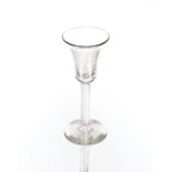 An antique wine glass, having bell shaped bowl and twist stem on circular spread foot, 16cm