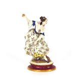 A continental porcelain figure, of a maiden curtseying, 30cm high