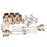 A collection of various silver and plated napkin rings, a pair of plated and cut glass salad