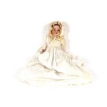 A large Armand Marseille porcelain headed doll, in lace trimmed bonnet and Christening dress;
