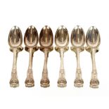 A George IV silver Kings pattern part canteen of cutlery, comprising six large table forks, four