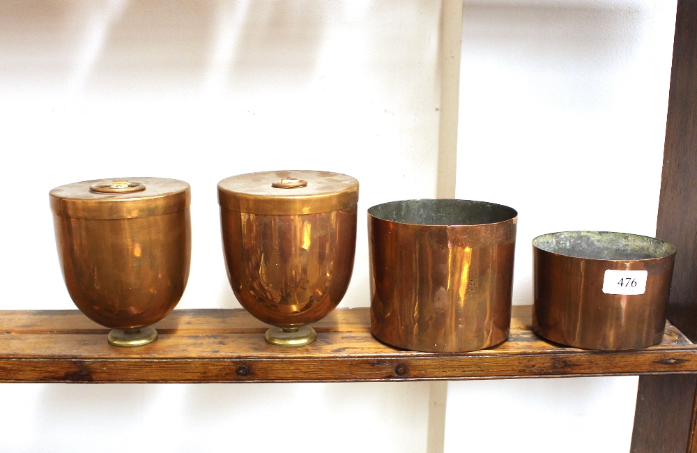 Two antique copper and brass ice cream pails; and two copper moulds (4)