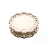 A George V small silver card tray, by Walker & Hall, having pie crust border and raised on three