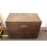 A large 19th Century oak trunk, flanked by brass carrying handles, 91cm wide