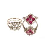 A yellow metal ring, set three diamonds; and an 18ct platinum, diamond and red stone set ring (2)