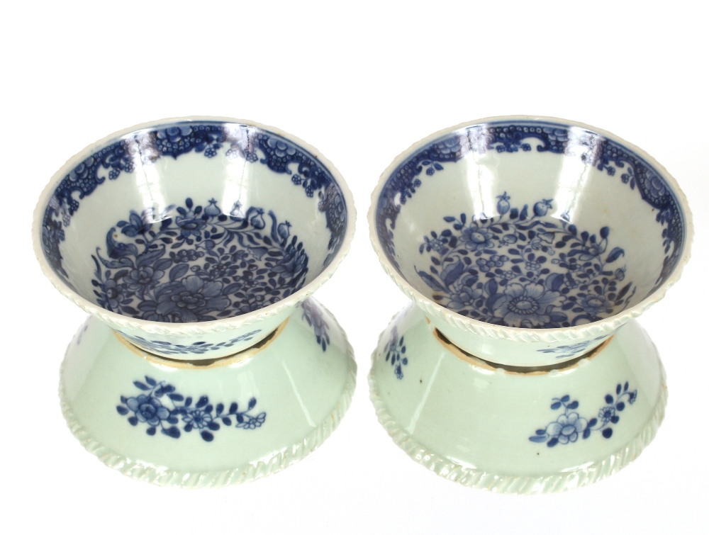 A pair of late 18th Century Chinese circular dishes, with ribbed borders and floral decoration on