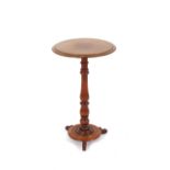 A Victorian circular mahogany occasional table, raised on turned baluster column terminating in