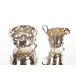 A late Victorian silver helmet shaped cream jug, and matching sugar bowl, Sheffield 1896 (2)