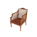 A 19th Century painted satinwood Bergere chair, raised on square section supports terminating in