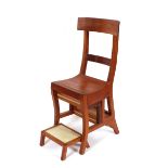 A contemporary teak metamorphic library chair, and matching stool (2)