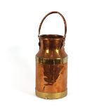 A copper and brass banded churn, with swing handle, 40cm high