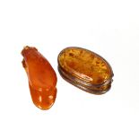 An amber and silver brooch, approx. 4cm x 2.6cm; and an amber pendant (2)