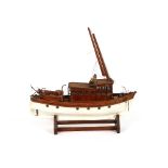 A wooden model of a fishing boat, raised on stand 74cm wide x 69cm high overall