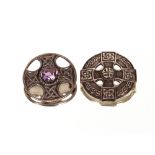 Two silver Scottish brooches, one with Celtic motif, the other inset with mauve stone