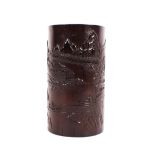 A fine late 18th / early 19th Century stained bamboo brush pot, carved with fisherman on a lake in a