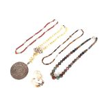 A large 48 bead agate necklace; a Zodiac pendant necklace; an agate necklace; a coral necklace; a