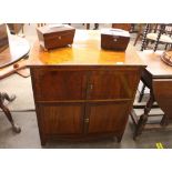 A 19th Century mahogany and ebony strung two tier night cupboard, raised on square tapering