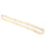 A 1930's graduated pearl necklace, with yellow metal clasp, 55cm long overall