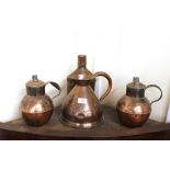 A pair of copper Guernsey jugs; a copper Imperial two pint measure, and a copper flask (4)