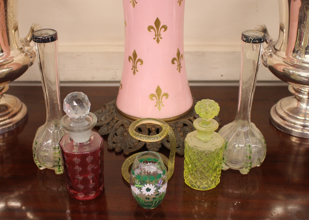 A pair of green tinted specimen vases, with silver mounts; a green glass scent bottle; an enamel