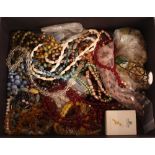 A tray of various costume beads, pendants etc.