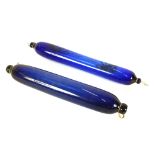 Two 19th Century blue glass rolling pins, 41cm long