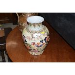 A large Chinese floral and bird decorated vase