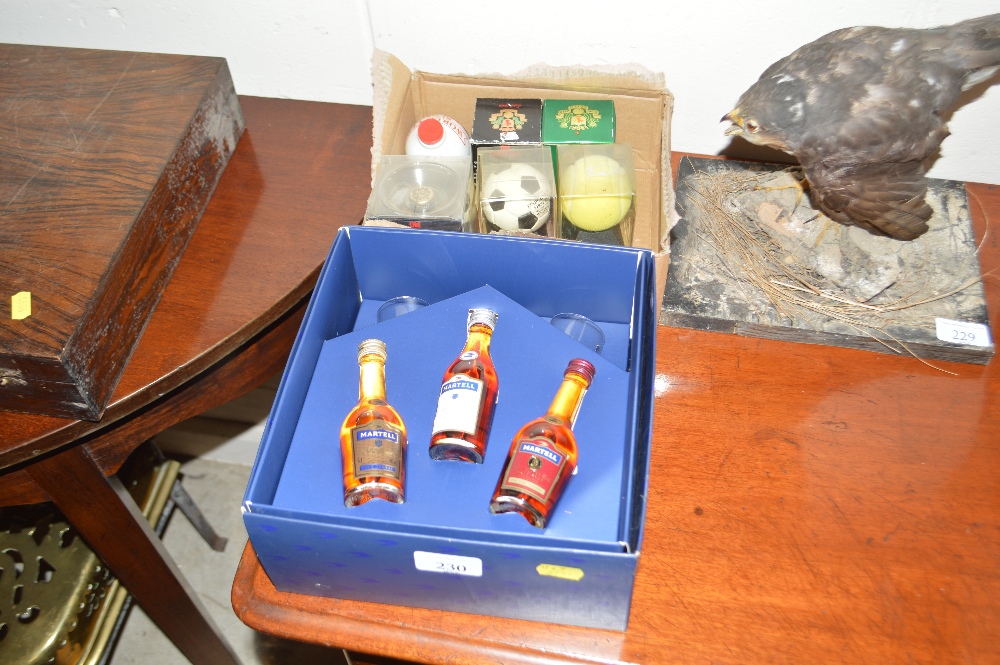 A box of sporting related miniatures, and Martell