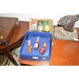 A box of sporting related miniatures, and Martell