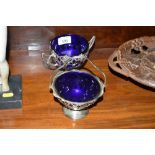 Two silver plated bonbon dishes each with blue gla