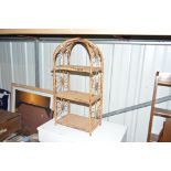 A bamboo and wicker hanging wall shelf