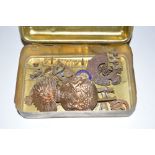 A 1914 brass Princess Mary Gift Tin containing bad