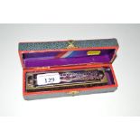A Hohner harmonica in original box