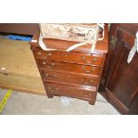 A mahogany chest fitted four drawers of small prop