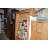 A modern pine and glazed wardrobe