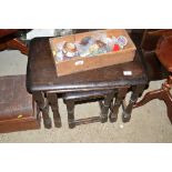 A nest of three oak occasional tables