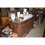 A heavy carved oak sideboard fitted two drawers