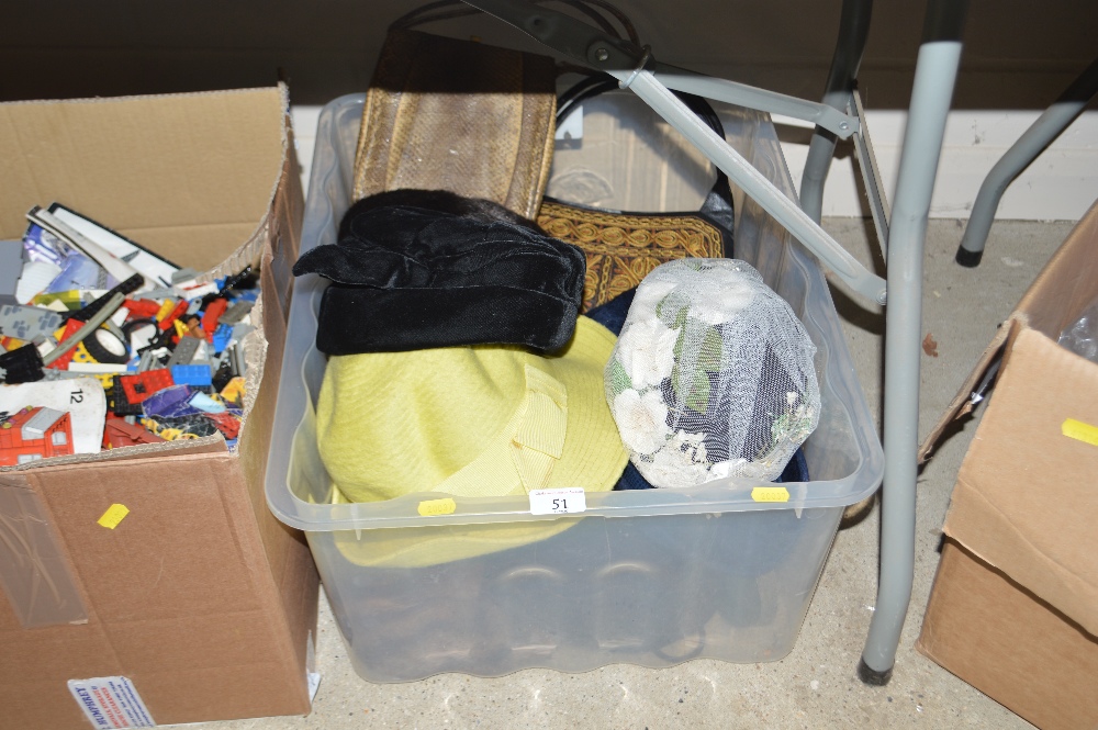A box of various hats and bags