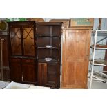 An Ercol elm corner cupboard