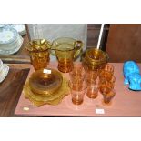 A quantity of amber glassware