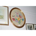 A gilt framed oval embroidery of flowers