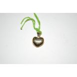 A 18ct gold heart shaped pendant