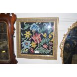 A gilt framed needlework embroidery of flowers