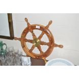 A small wooden ships wheel