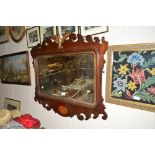 An Edwardian mahogany and gilt decorated wall mirr