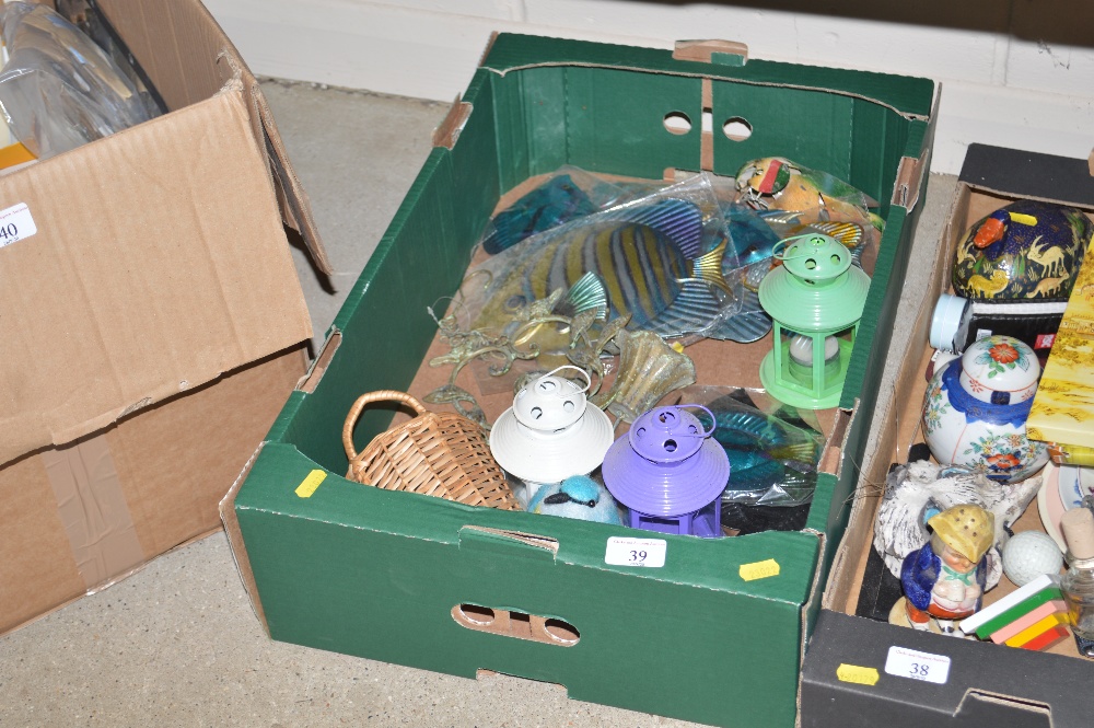 A box containing small metal candle lanterns, deco