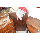 A Georgian oak hanging corner cupboard