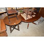 An oak circular topped table and a reproduction ma