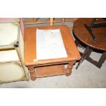 A modern pine square topped two tier coffee table