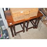 A nest of three mahogany occasional tables